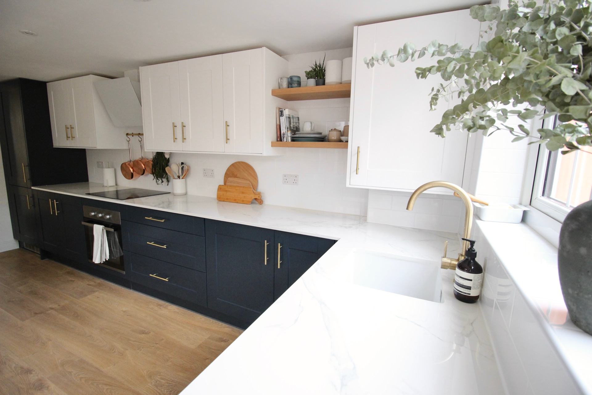The Root and Bloom kitchen with its bright worktop and greenery
